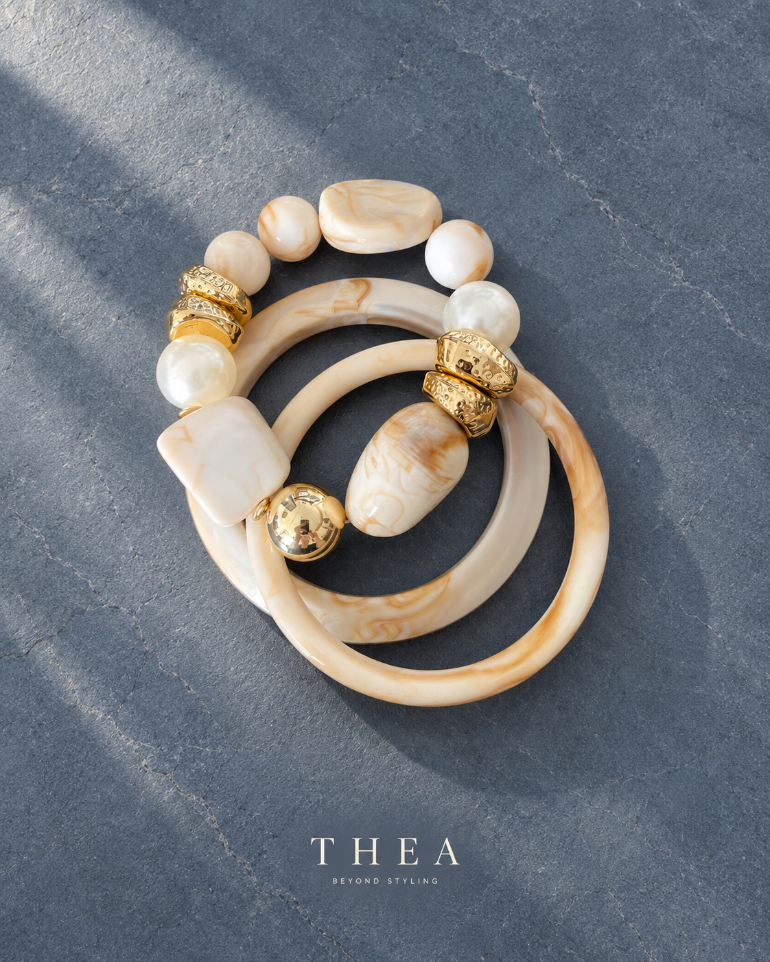 Ivory Muse Stack marbled bangles and pearl bead bracelet flat lay
