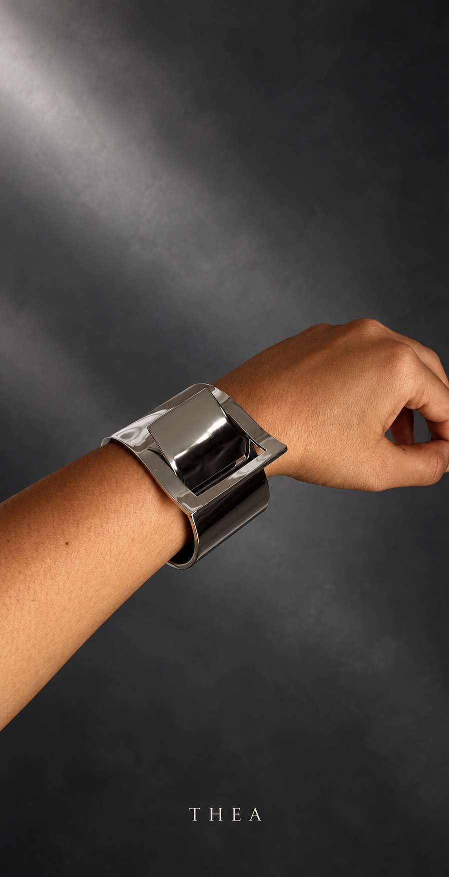 Mirror Frame Cuff in polished silver tone worn on wrist