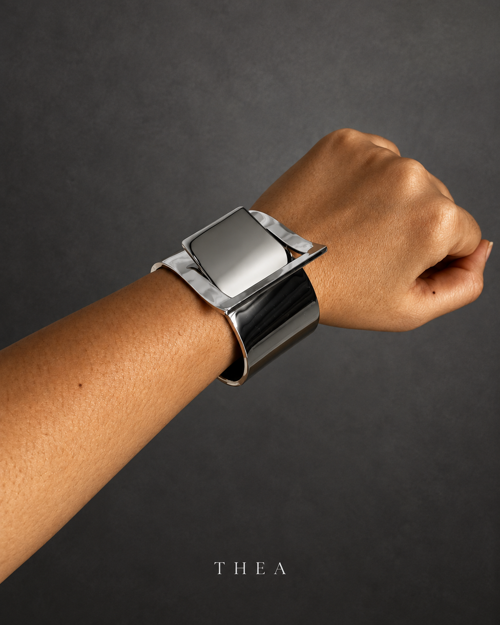 Mirror Frame Cuff in polished silver tone worn on wrist