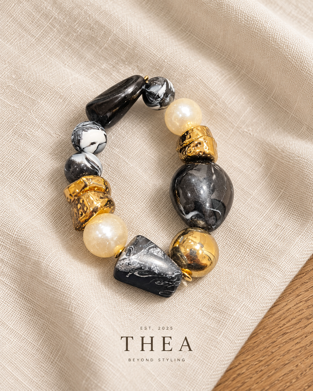 Noir Mosaic Bracelet with black, charcoal marbled, pearl-look and gold-tone beads