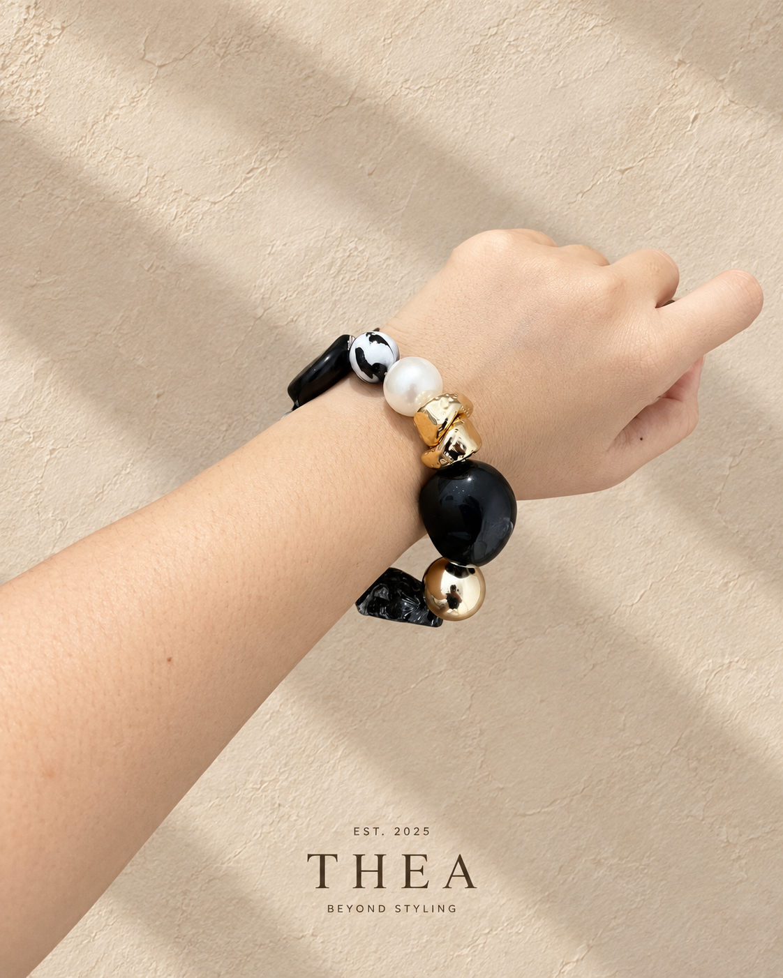 Noir Mosaic Bracelet with black, charcoal marbled, pearl-look and gold-tone beads