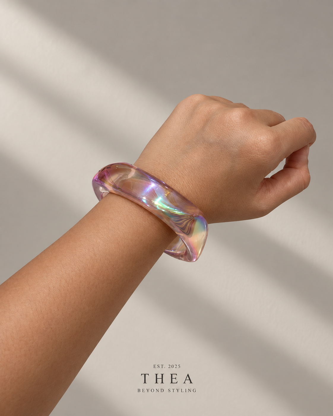 Prism Sculpt Bangle in opal with rainbow reflections
