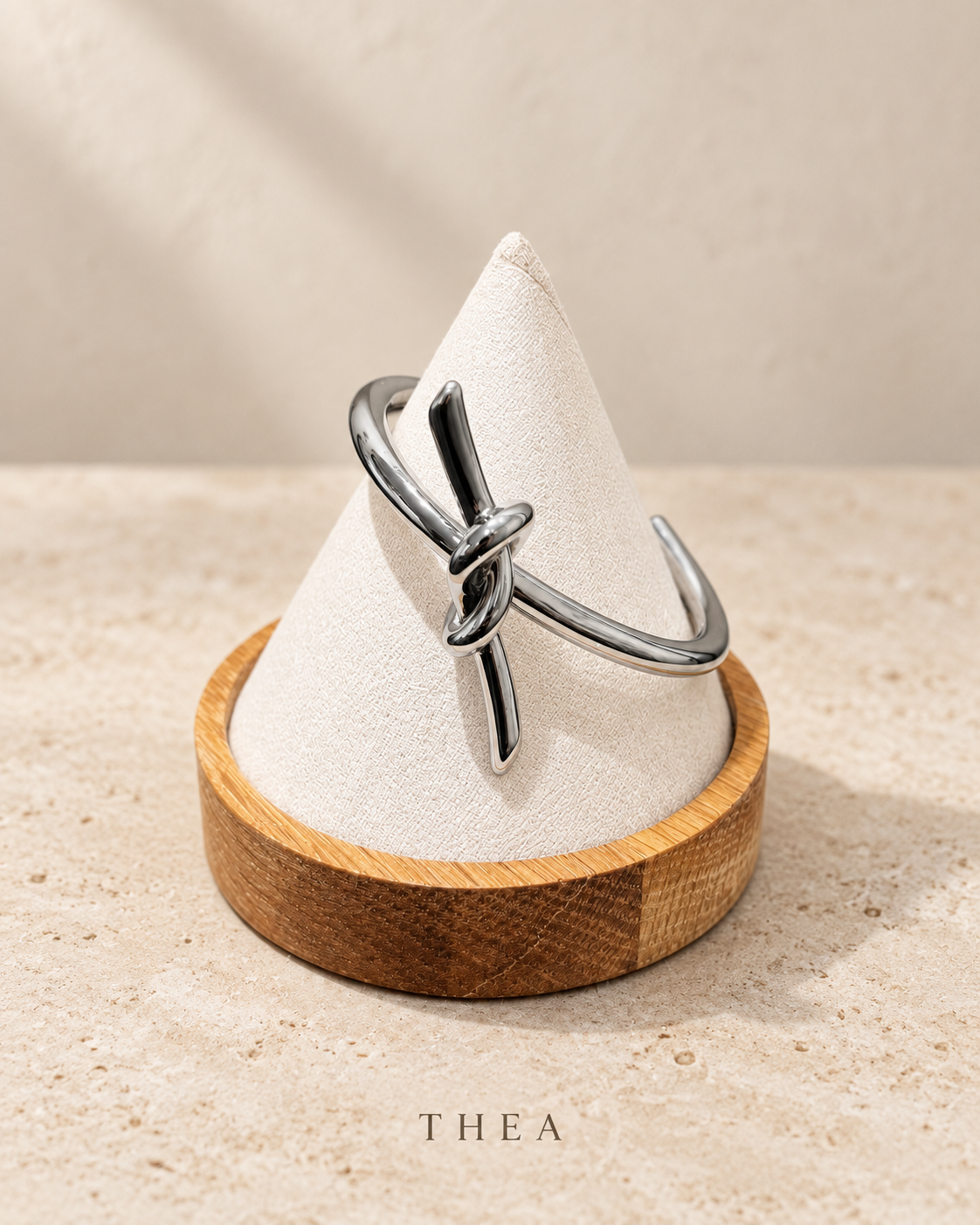 Silver Knot Bangle in polished silver tone