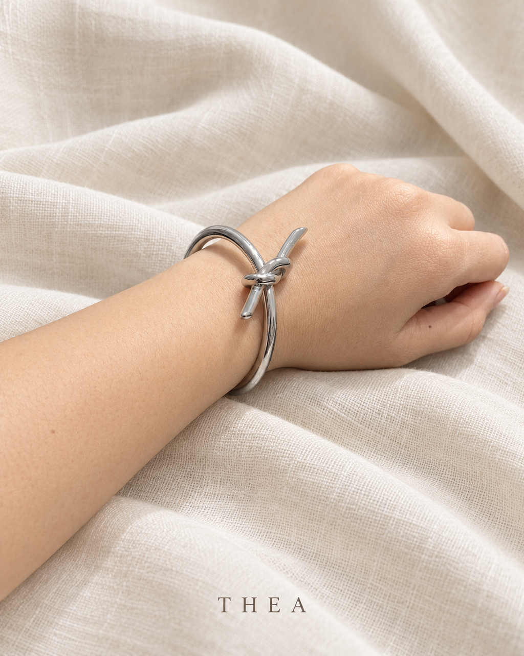 Silver Knot Bangle in polished silver tone