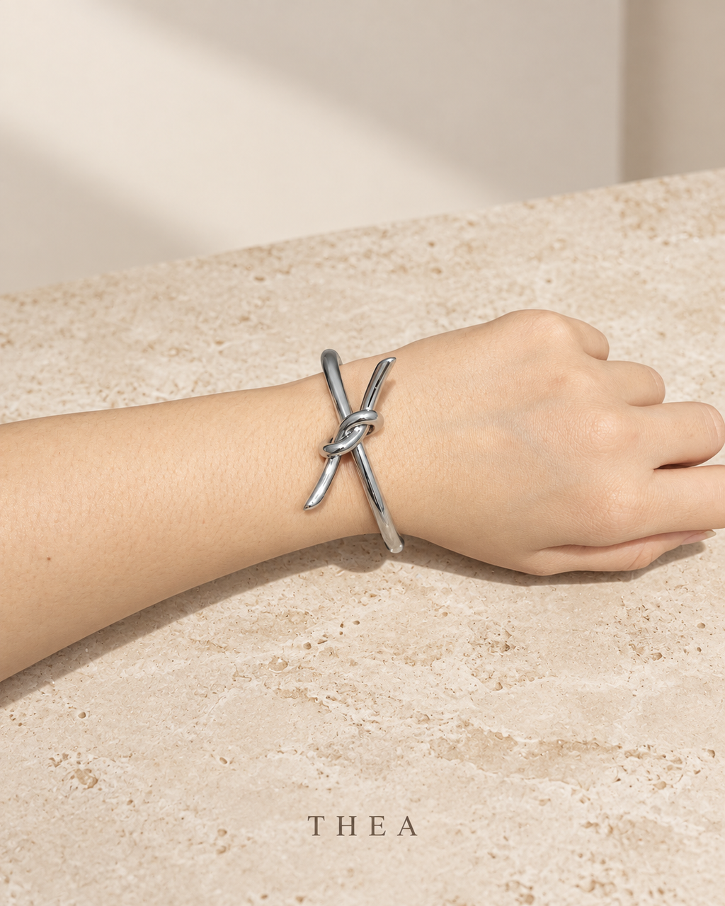 Silver Knot Bangle in polished silver tone