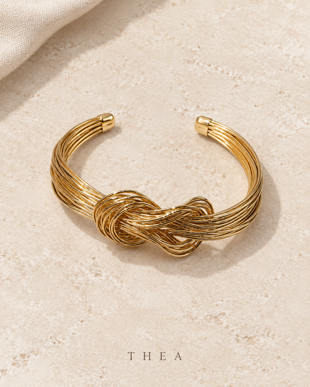 Golden Thread Bangle with gold-tone interwoven knot