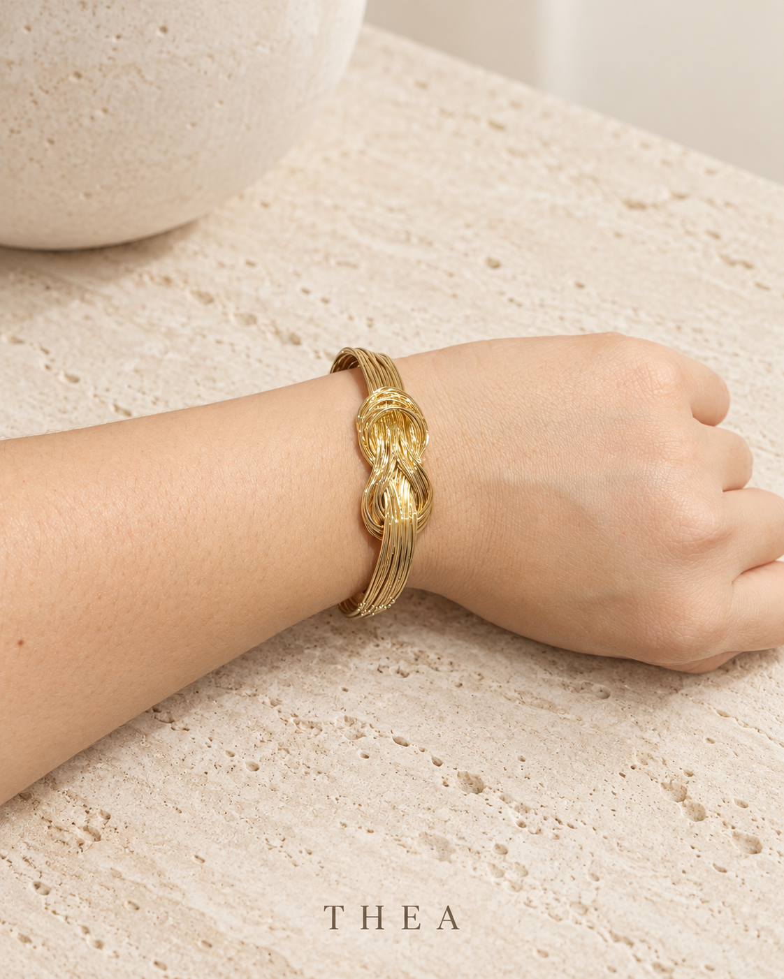 Golden Thread Bangle with gold-tone interwoven knot