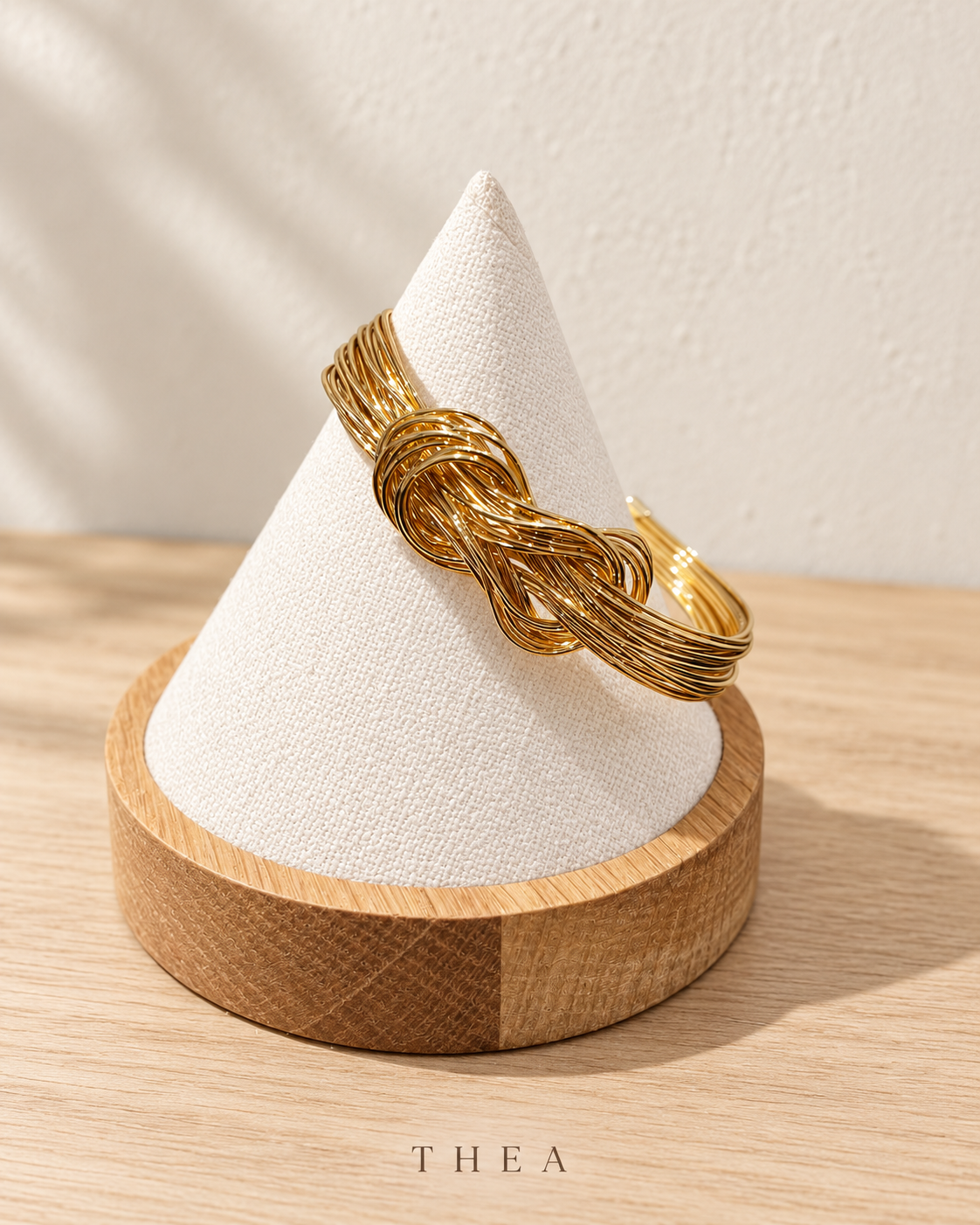 Golden Thread Bangle with gold-tone interwoven knot