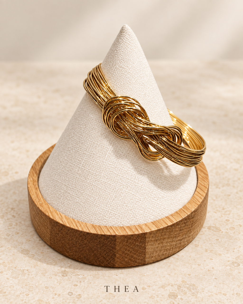 Golden Thread Bangle with gold-tone interwoven knot