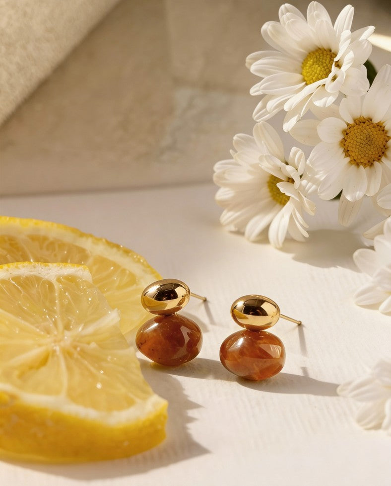 Brown stone-inspired Pebble Poise Studs with polished gold-toned tops