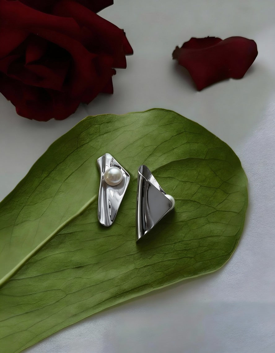 Silver sculptural folded earrings with pearl accents