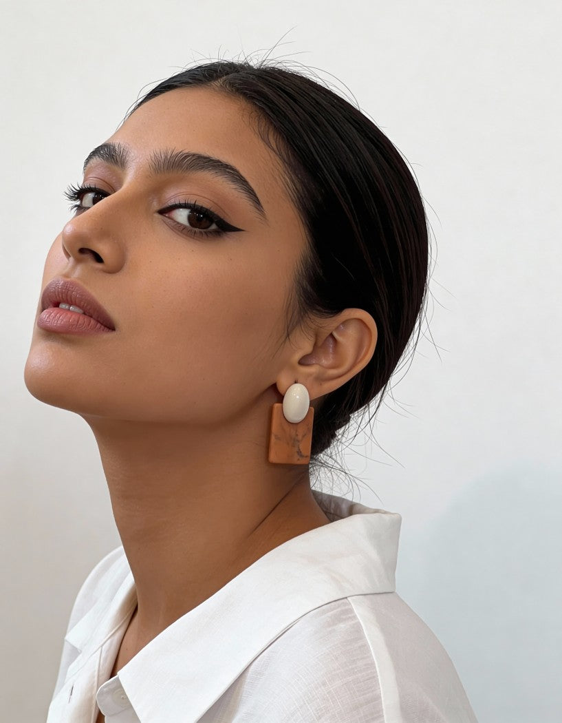 Model wearing rust marble-inspired Palette Block Earrings